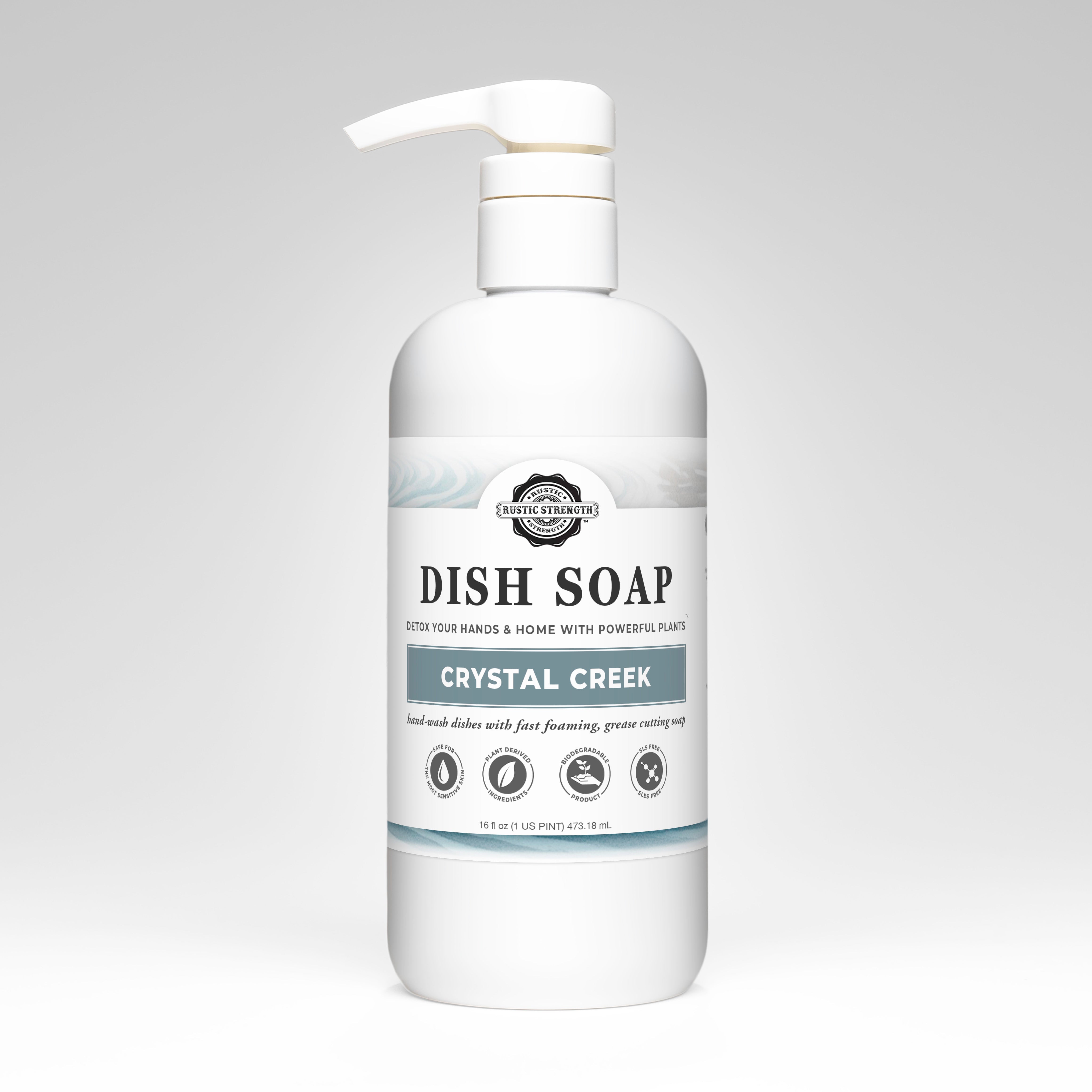 Bottle of Crystal Creek dish soap on a gray background