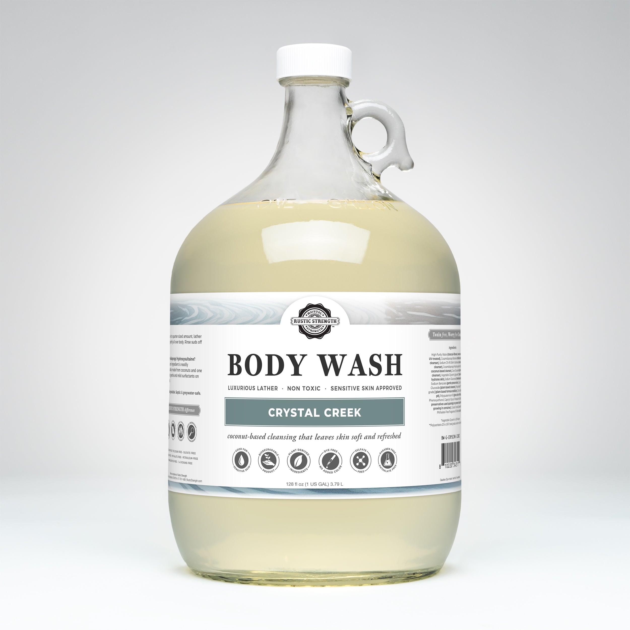 Gallon glass bottle of Crystal Creek body wash on a white background