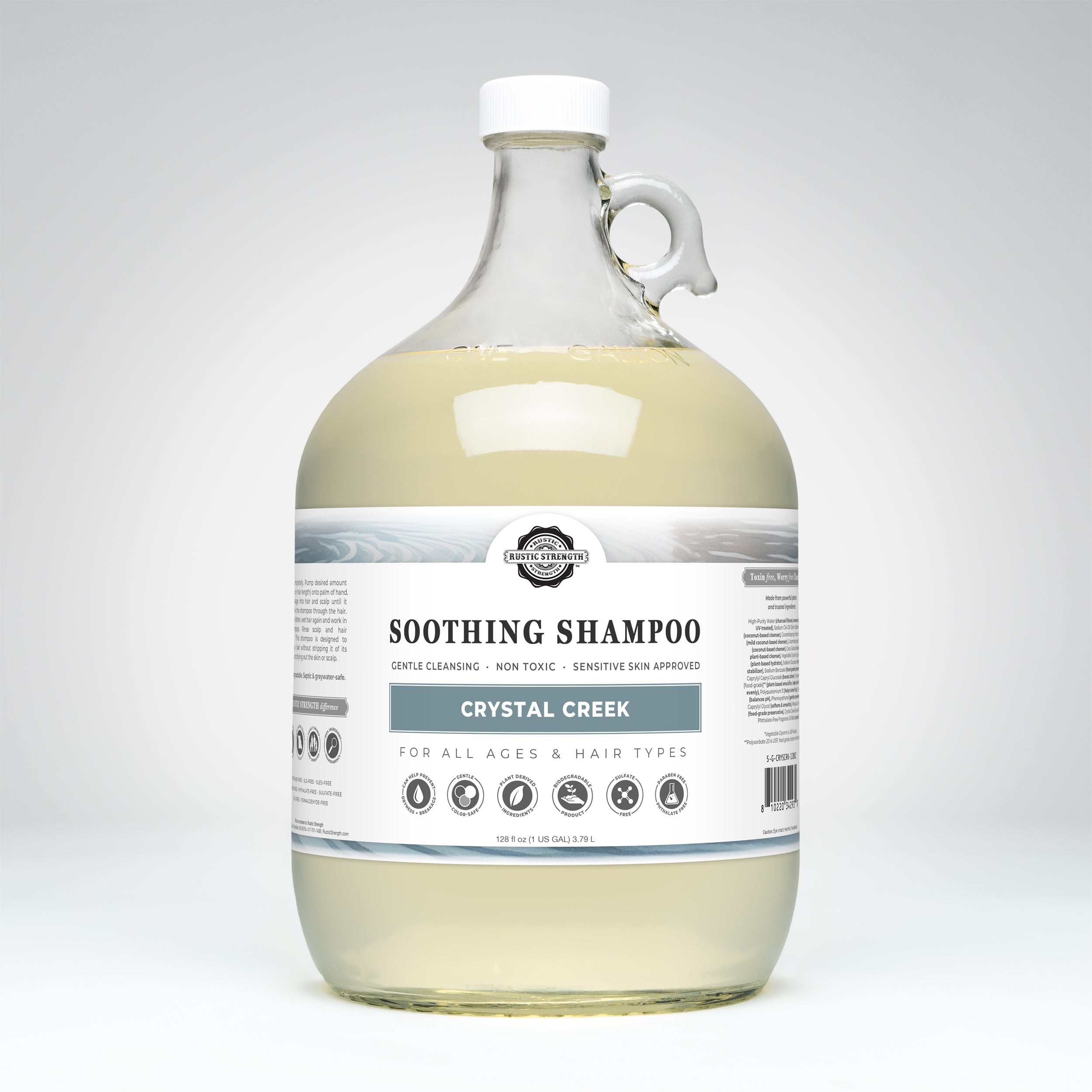 Gallon glass bottle of Crystal Creek soothing shampoo on a white background
