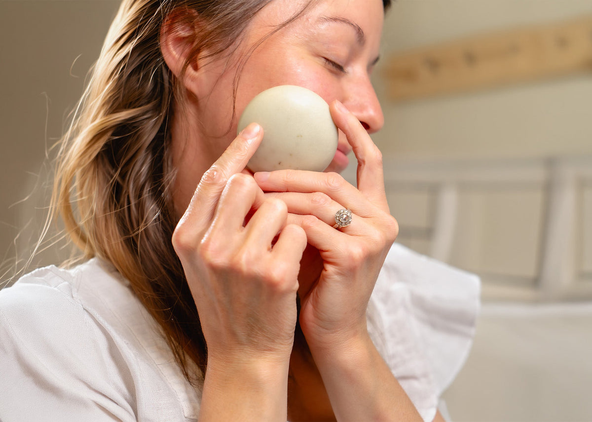 Rustic Strength, Nourish, 2.5oz Face Bar, Soothing Nettle being used on woman's face