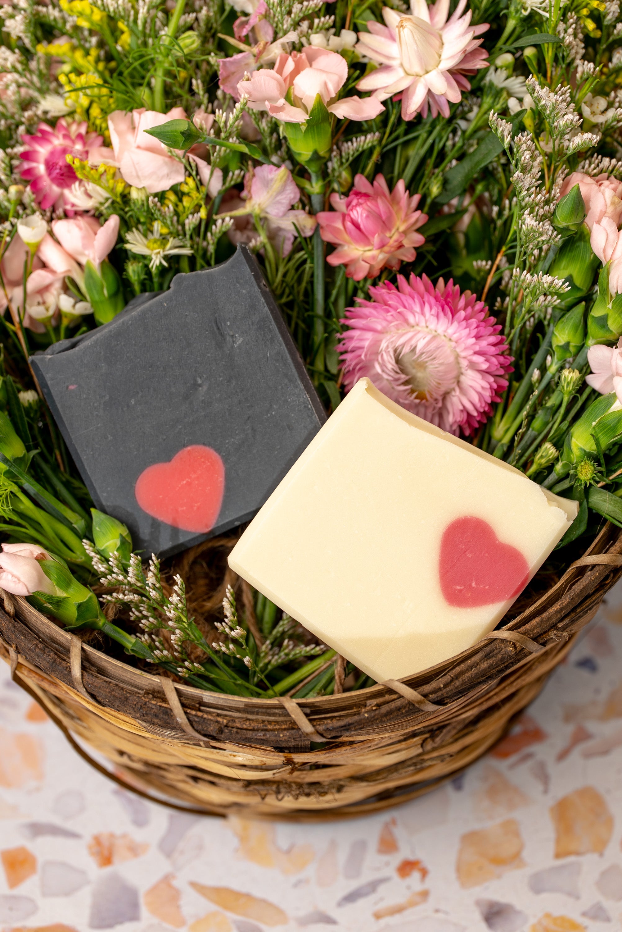 His and hers Valentine's Day soap bars in a basket of flowers